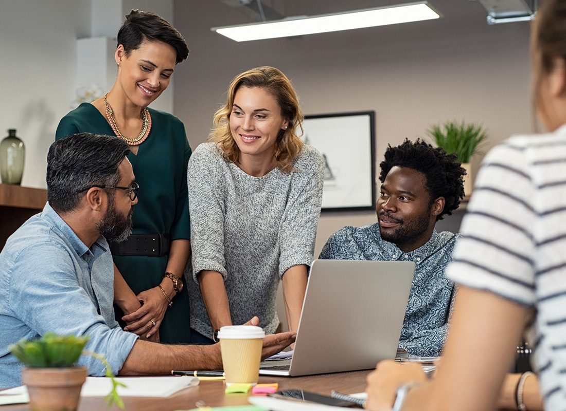 Insurance Solutions - Group of Business Professionals Having a Friendly Meeting at an Office